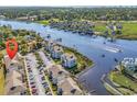 Aerial view of condos on the waterway with boat docks and golf course in the distance at 4430 Eastport Blvd. # L15, Little River, SC 29566