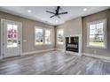 Bright and airy living room boasts a modern fireplace, recessed lighting, and several large windows at 468 Saint Julian Ln., Myrtle Beach, SC 29579