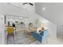 Inviting living room with high ceilings, dining area, and seamless flow into the modern kitchen at 513 38Th Ave. N # 202, Myrtle Beach, SC 29577