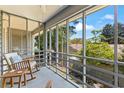 Screened porch with seating, providing a relaxing outdoor space at 513 38Th Ave. N # 202, Myrtle Beach, SC 29577