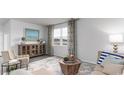 Bright living room boasting a large window, neutral color palette, and stylish furniture at 540 Duvall St., Longs, SC 29568