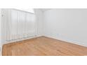 Empty bedroom with hardwood floors and a window covered with sheer curtains at 736 Lalton Dr., Conway, SC 29526