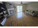 Comfortable living room with a decorative fireplace, and sliding glass doors at 830 44Th Ave. N # B4, Myrtle Beach, SC 29577