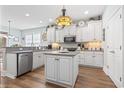Bright kitchen featuring white cabinetry, granite countertops, and stainless steel appliances at 929 Tidewater Dr., North Myrtle Beach, SC 29582