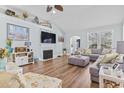Spacious living room featuring a fireplace, large sectional, and ample natural light at 929 Tidewater Dr., North Myrtle Beach, SC 29582