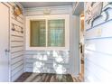 Inviting entryway featuring nautical decor, a window, and a glimpse into the home's interior at 9581 Shore Dr. # 223, Myrtle Beach, SC 29572