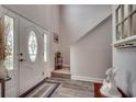 Welcoming entryway features wood flooring, and a decorative glass front door with sidelights at 1001 Harvest View Ave., Conway, SC 29527