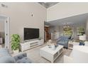 Bright living room boasts vaulted ceilings and an open layout to the kitchen and dining area at 1004 Harvester Circle # 1004, Myrtle Beach, SC 29579