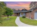 Charming brick home with well-manicured lawn and inviting walkway at 112 Boxwood Ln., Conway, SC 29526
