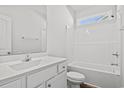 Bright bathroom featuring a white vanity with a sleek sink, toilet and a shower-tub combination at 116 Old Chimney Ln, Conway, SC 29526