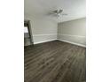 Spacious living room with stylish flooring, neutral walls, and a ceiling fan at 1432 Highway 544 # F1, Conway, SC 29526