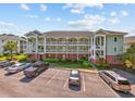 Low angle shot of attractive condo building featuring multiple floors, staircases and parking at 1514 Lanterns Rest Rd. # 304, Myrtle Beach, SC 29579