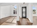 Elegant foyer with dark wood floors, decorative door, and detailed trim work at 163 Sago Palm Dr., Myrtle Beach, SC 29579