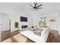 Bright living room with fireplace, white walls, and sliding glass doors at 163 Sago Palm Dr., Myrtle Beach, SC 29579