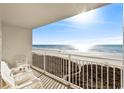 Balcony with chairs overlooking the ocean and beachfront at 1709 S Ocean Blvd. S # 205, North Myrtle Beach, SC 29582