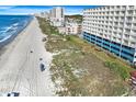 Expansive aerial view of the condo building showing its proximity to the ocean and beach at 1709 S Ocean Blvd. S # 205, North Myrtle Beach, SC 29582