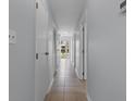 Clean, bright hallway with tile flooring leads to the front door and other rooms at 1890 Colony Dr. # 17S, Myrtle Beach, SC 29575