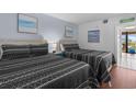 Inviting bedroom showcasing two beds with coastal decor and a balcony view, perfect for a restful vacation at 208 74Th Ave. N # 2517, Myrtle Beach, SC 29572