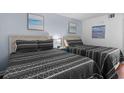 This serene bedroom features two beds with stylish patterned bedding and soft lighting, creating a relaxing retreat at 208 74Th Ave. N # 2517, Myrtle Beach, SC 29572