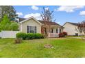 Lovely home with a neat lawn and decorative bushes in the front yard at 2446 Farmwood Circle, Conway, SC 29527