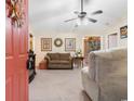 Comfortable living room featuring neutral walls, a ceiling fan and plush seating at 2446 Farmwood Circle, Conway, SC 29527