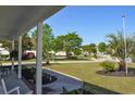 Peaceful neighborhood view from the covered porch, surrounded by trees and greenery at 2703 Canvasback Trail, Myrtle Beach, SC 29588