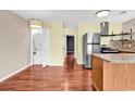 Efficient kitchen includes stainless appliances, wood cabinets, granite countertops, and laundry closet at 3700 Golf Colony Lane # 5J, Little River, SC 29566
