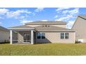 Home's back exterior featuring a covered porch, a well manicured lawn and a fenced yard at 434 Clear Lake Dr., Conway, SC 29526
