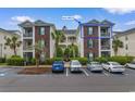 Beautiful condo with brick accents, private balcony, and well-maintained landscaping at 480 River Oaks Dr. # 63-O, Myrtle Beach, SC 29579
