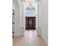 Elegant foyer with columns and an arched transom over the front door, offering a glimpse of the sky at 482 Pomo Dr., Myrtle Beach, SC 29579