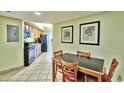 Bright dining area adjacent to the kitchen with a table, chairs, and decorative wall art at 504 N Ocean Blvd. # 1810, Myrtle Beach, SC 29577