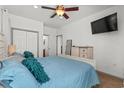 Cozy main bedroom with large bed, closet, and view of the en suite bathroom at 77 Weatherboard Ct., Pawleys Island, SC 29585