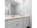 Bathroom featuring double vanity, countertop, large mirror, and glass enclosed shower at 977 Cherrystone Loop, Conway, SC 29526