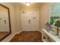 Hallway showing tiled floor, a decorative table, mirror, and door at 100 North Beach Blvd. # 1801, North Myrtle Beach, SC 29582