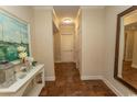 Inviting hallway with tiled floor, a decorative table, and a mirror at 100 North Beach Blvd. # 1801, North Myrtle Beach, SC 29582