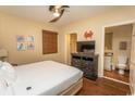 Cozy bedroom with wood flooring, dresser, and attached bathroom creating a functional and comfortable space at 100 North Beach Blvd. # 313, North Myrtle Beach, SC 29582