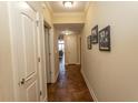 Hallway with unique tile flooring, crown molding, and decorative artwork creating an inviting space at 100 North Beach Blvd. # 313, North Myrtle Beach, SC 29582