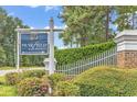 Muirfield at Blackmoor sign with brick and white fence at 1151 N Blackmoor Dr., Murrells Inlet, SC 29576