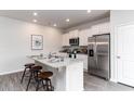 Bright kitchen featuring stainless steel appliances, granite countertops, and an island with bar seating at 1434 Nokota Dr., Conway, SC 29526