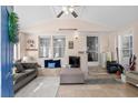 Bright sun room with tiled floors, modern ceiling fan, sofa, and great natural light at 168 Saint Christopher Circle, Pawleys Island, SC 29585