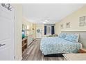 This inviting bedroom is designed with a queen bed, wood look flooring, and plenty of room to relax at 200 76Th Ave. N # 1009, Myrtle Beach, SC 29572