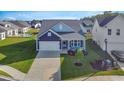 Aerial view of a lovely home with manicured lawn in a desirable neighborhood with a community pool at 2005 Tiller Ct., Myrtle Beach, SC 29579