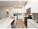 Modern kitchen featuring stainless steel appliances, a large island, and ample counter space at 4344 Falls Oaks St., Myrtle Beach, SC 29579