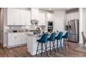 Modern kitchen with stainless steel appliances, granite countertops, ample cabinet space, and a center island with seating at 4827 Hopespring St., Myrtle Beach, SC 29579