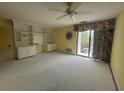 Bedroom featuring a ceiling fan, sliding glass doors to a small patio, and built-in shelving at 5001 Little River Rd. # E-410, Myrtle Beach, SC 29577