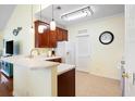 Bright eat-in kitchen featuring tile flooring, marble countertops, and stainless steel faucet at 5876 Longwood Dr. # 201, Murrells Inlet, SC 29576