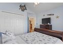 Cozy bedroom featuring a ceiling fan, closet, and television at 812 Buteo Ct., Myrtle Beach, SC 29588