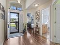 Welcoming foyer with hardwood floors, high ceilings, and views into the bedroom and bathroom at 812 Buteo Ct., Myrtle Beach, SC 29588