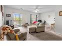 Inviting living room with sliding glass doors and ceiling fan offers a bright and airy atmosphere at 1058 Sea Mountain Hwy. # 5-301, North Myrtle Beach, SC 29582