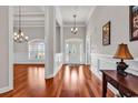 Inviting foyer features hardwood floors, decorative lighting, and a stylish front door at 120 Whitemarsh Ct., Murrells Inlet, SC 29576